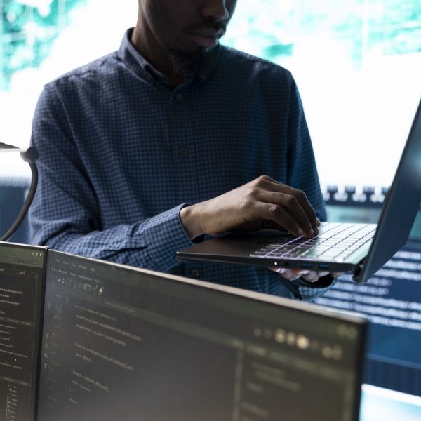 Cyber security team conducting cyber surveillance and threat detection Cyber security team conducting cyber surveillance and threat detection in a governmental agency. Hackers working on cybercrime and malware prevention, data breach protection.