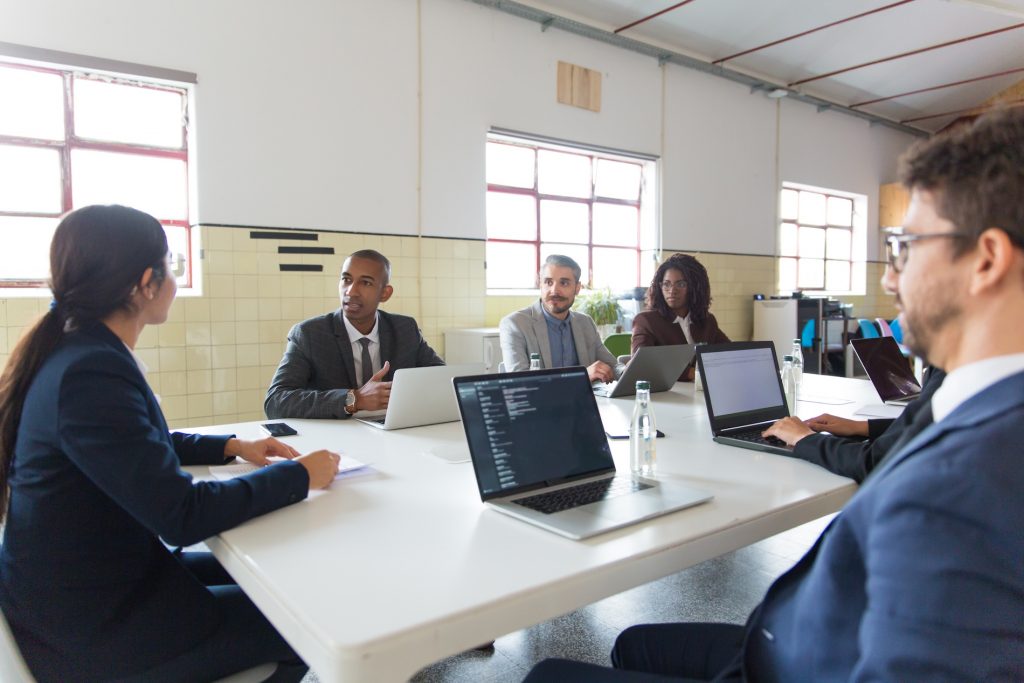 Inland Empire business team in a staff meeting reviewing security awareness practices for phishing prevention